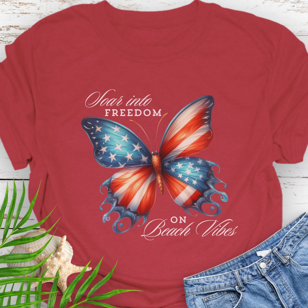 Red American flag butterfly T-shirt with “Soaring into Freedom” slogan, made of 100% ring-spun cotton, classic fit with crew neckline, perfect for patriotic holidays.