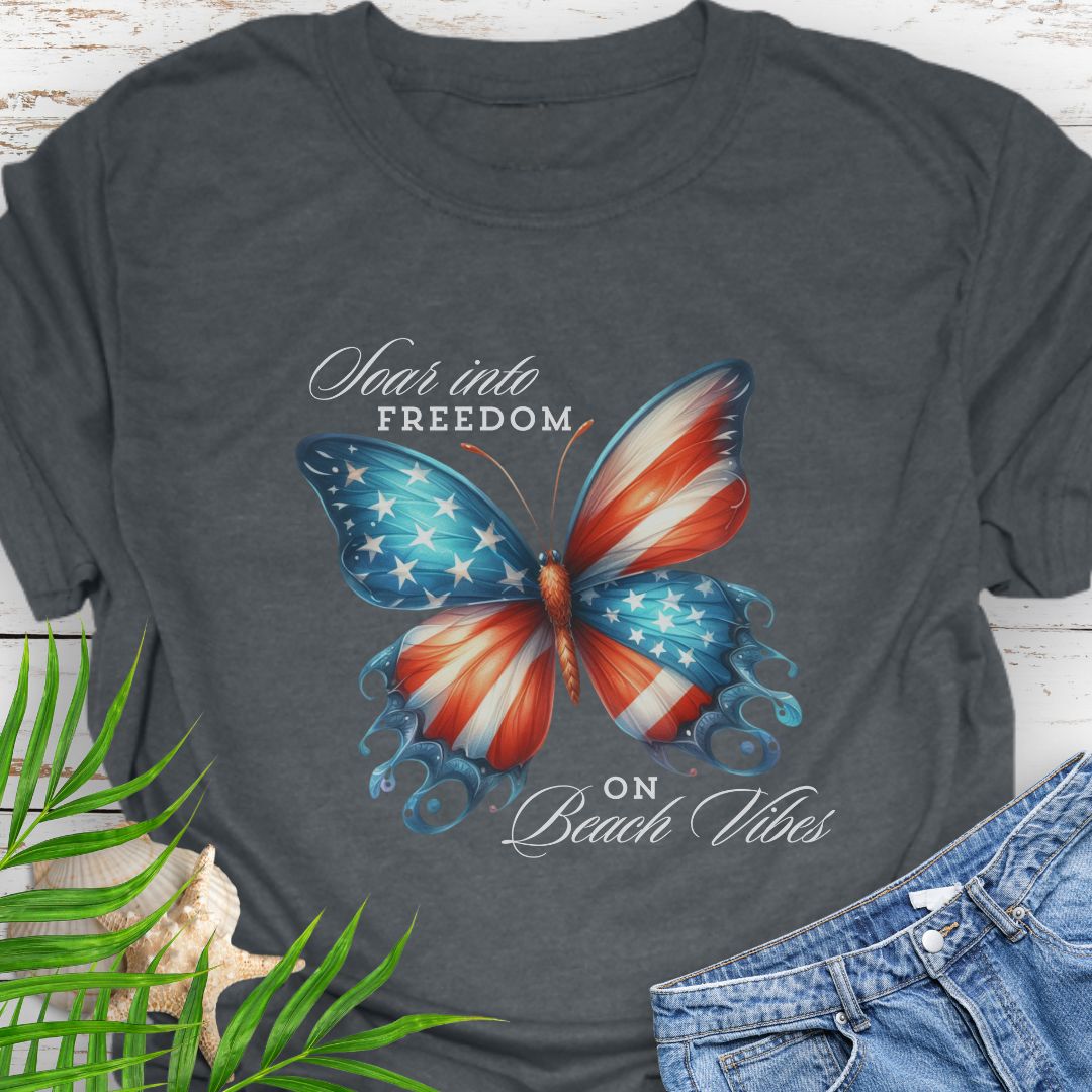 Dark Heather American flag butterfly T-shirt with “Soaring into Freedom” slogan, made of 100% ring-spun cotton, classic fit with crew neckline, perfect for patriotic holidays.