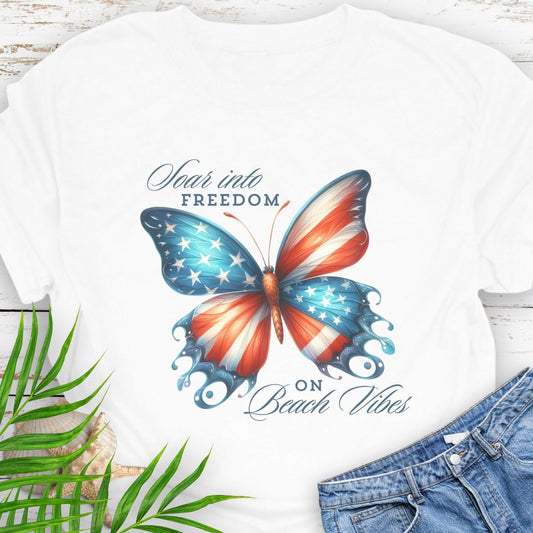 White American flag butterfly T-shirt with “Soaring into Freedom” slogan, made of 100% ring-spun cotton, classic fit with crew neckline, perfect for patriotic holidays.