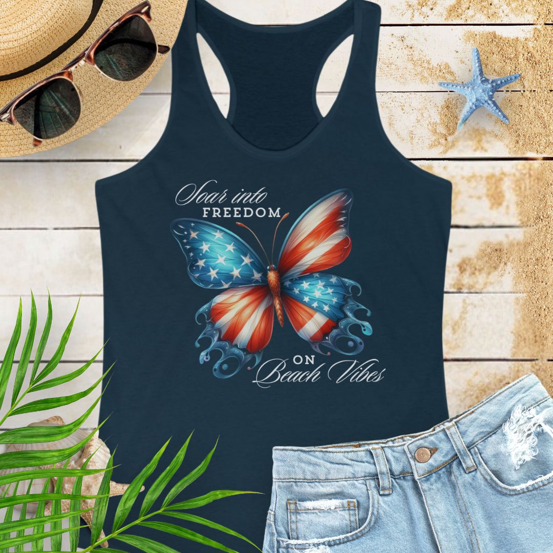 Navy patriotic women’s tank top with a American flag butterfly design and “Soaring into Freedom” slogan, featuring a scooped neckline and tear-away label.