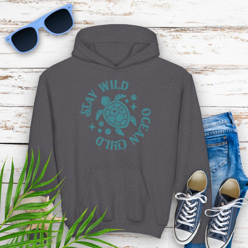 Dark heather child hoodie with sea turtle with surrounding text Stay Wild Ocean Child.