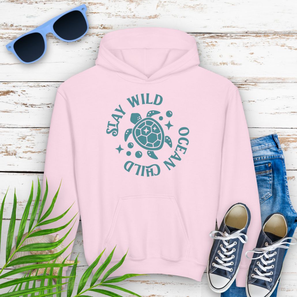 Light Pink child hoodie with sea turtle with surrounding text Stay Wild Ocean Child.