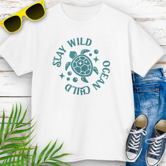 White kids ocean-themed T-shirt with sea turtle design and coastal vibes with phrase Stay Wild Ocean Child around sea turtle.