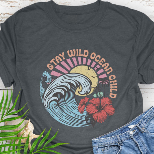 Dark Heather  circular beach design with ocean wave, sun, and hibiscus flower and the phrase “Stay Wild Ocean Child”.