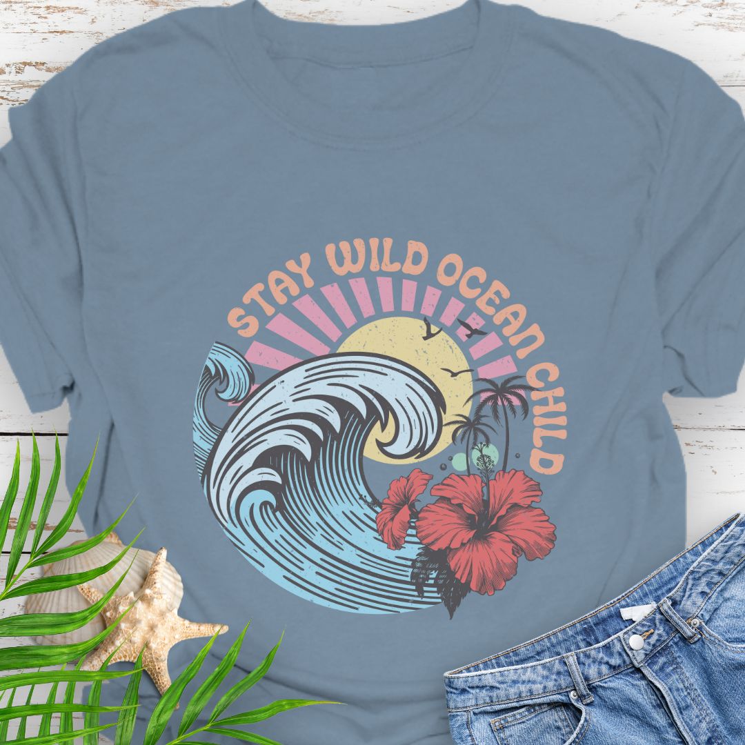 Stone Blue circular beach design with ocean wave, sun, and hibiscus flower and the phrase “Stay Wild Ocean Child”.