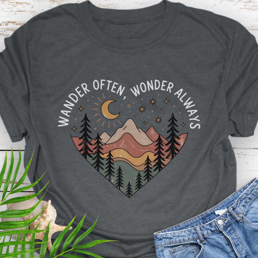 Dark Heather gray Unisex t-shirt with mountain and trees in a heart shape and the phrase "Wander Often, Wonder Always".