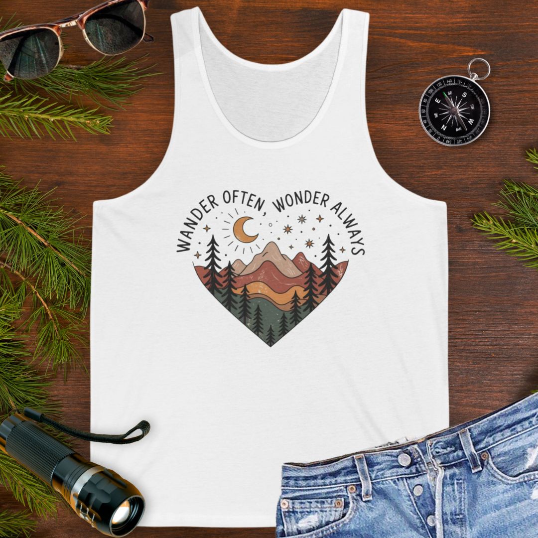 White unisex tank top with boho-style mountain landscape enclosed within a heart shape with wander often, wander always at the top of the heart.