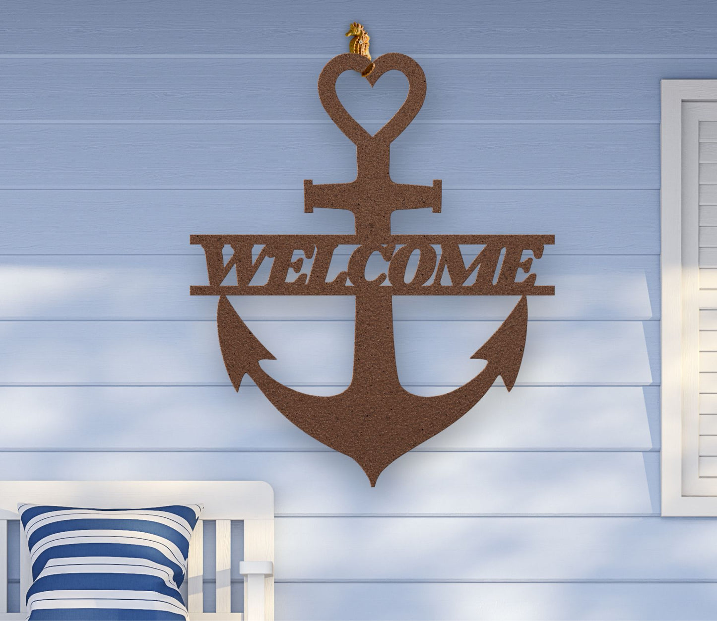 Copper metal wall art shaped like an anchor with a heart at the top and the word “Welcome” cut out in the center; made of powder-coated steel.