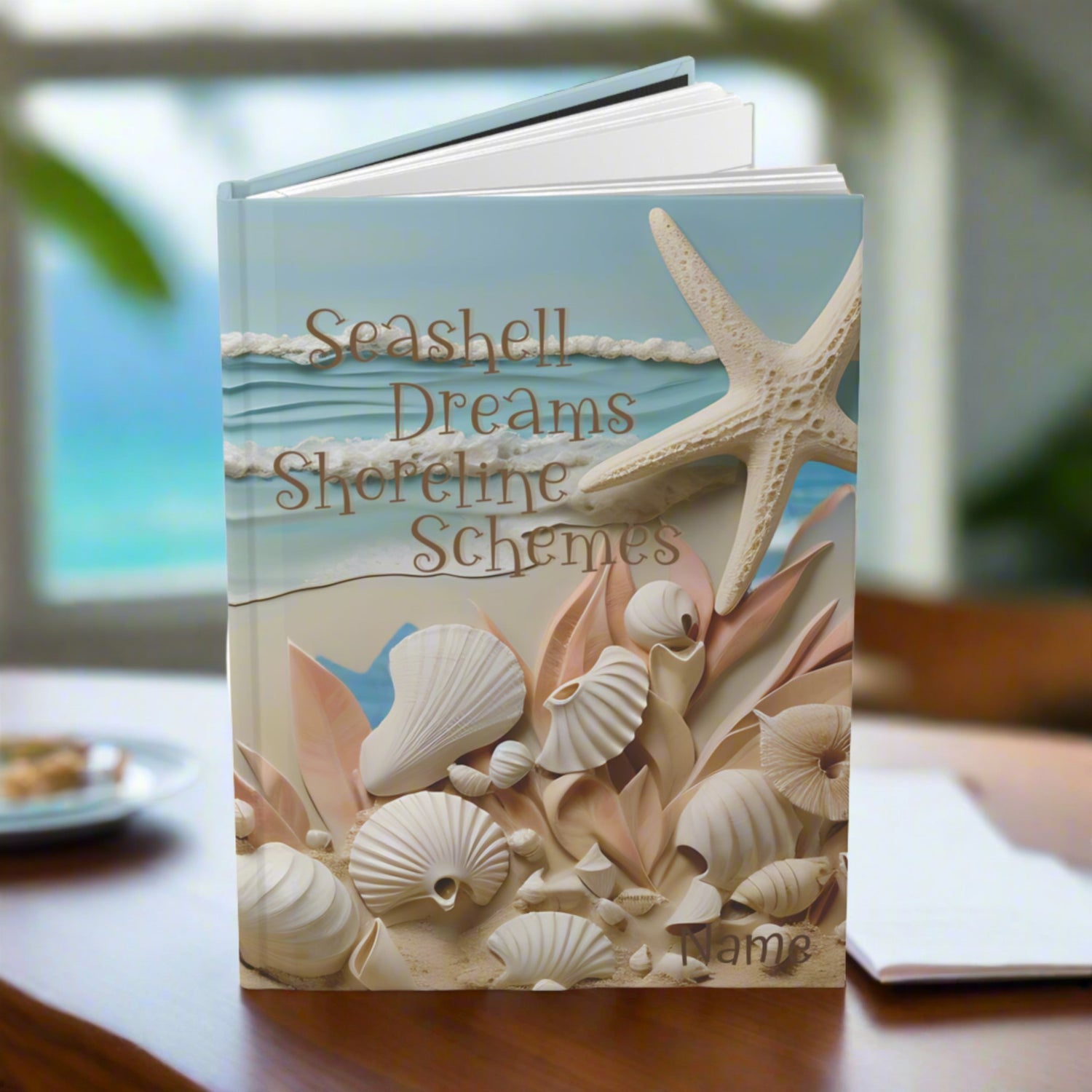 Hardcover Journal with ocean waves and seashells with the text Seashell Dreams Shoreline Schemes.