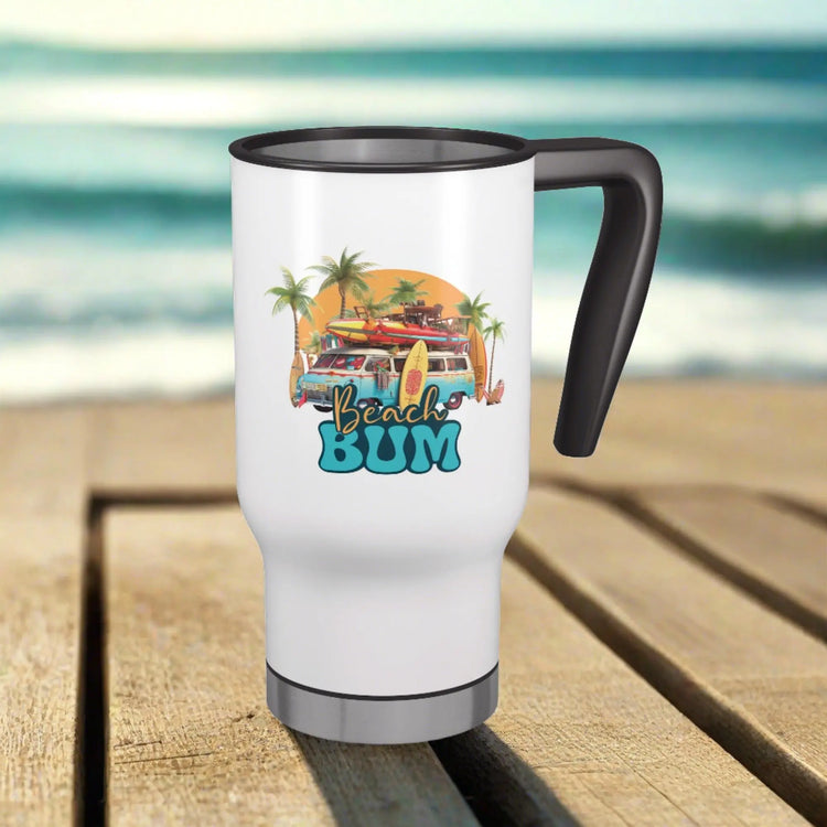 A white Stainless Steel Travel Mug with Handle a beach van with surfboards on the roof that says Beach Bum while sitting on table at the ocean.