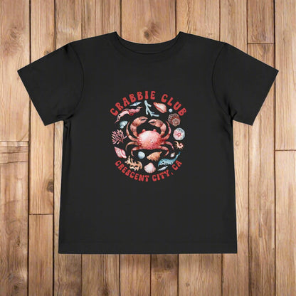 Black Toddler t-shirt with the phrase “Crabbie Club Crescent City, CA” and a playful cartoon crab graphic.