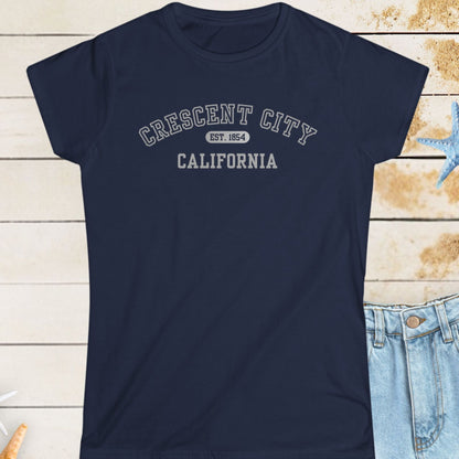 Navy blue t-shirt with 'Crescent City, California' text on a wooden surface with starfish.