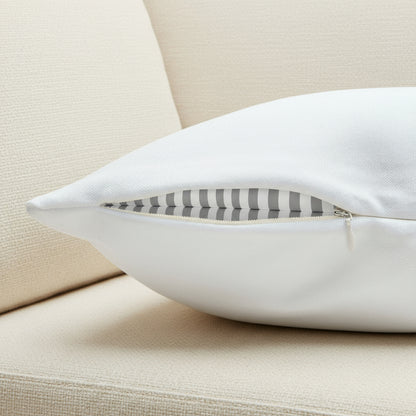 White pillow with a zipper on a white background