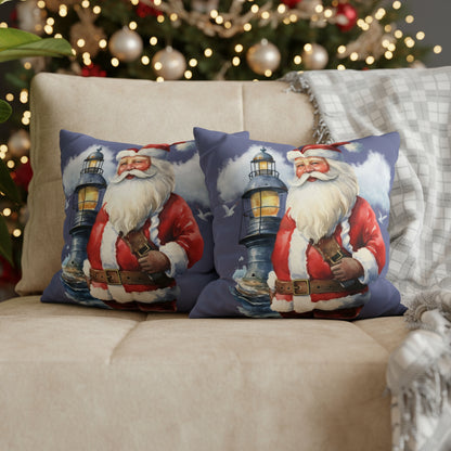 Two decorative pillows with Santa Claus holding a lantern on a sofa.