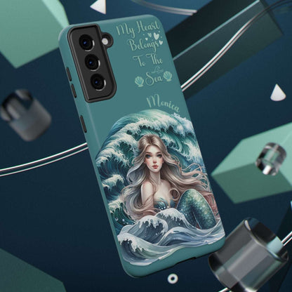 iPhone case with mermaid design and text on a blue background