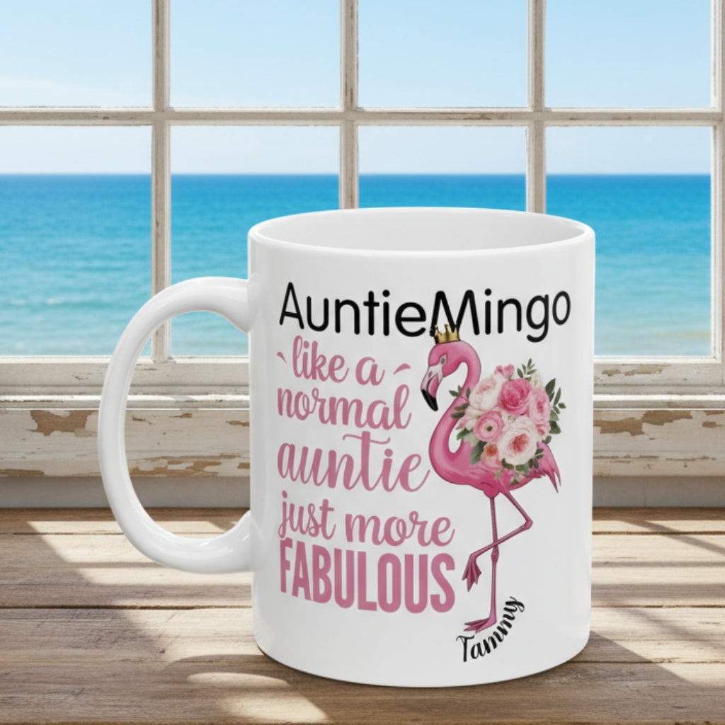 White mug with pink flamingo design and text on a white background