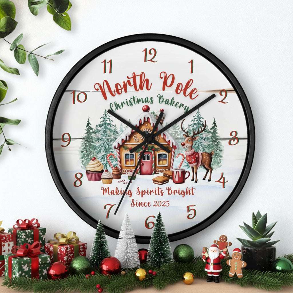 Decorative Christmas-themed clock with a gingerbread house and reindeer on a white background.