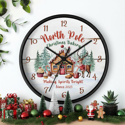 Decorative Christmas-themed clock with a gingerbread house and reindeer on a white background.