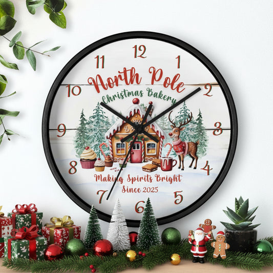 Decorative Christmas-themed clock with a gingerbread house and reindeer on a white background.