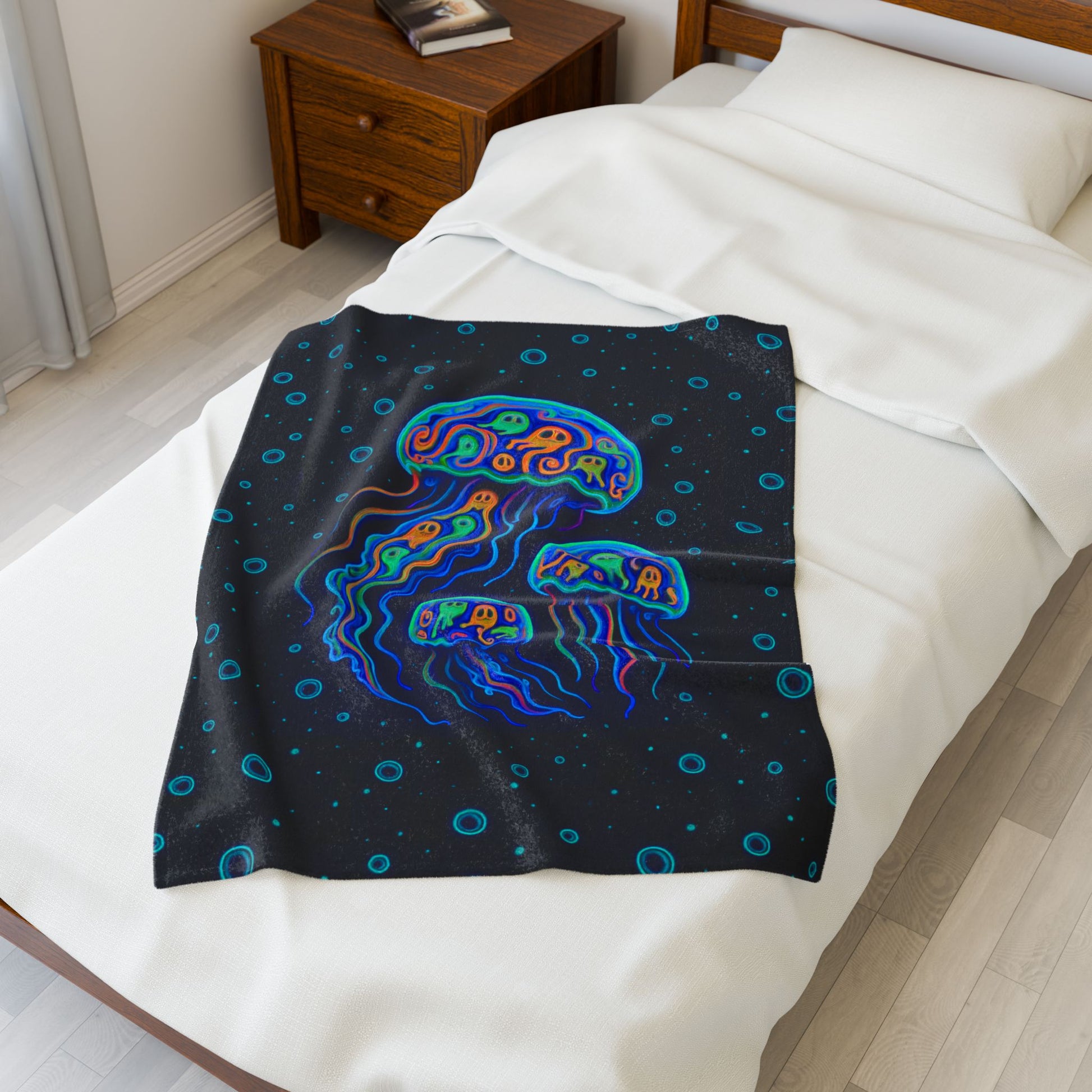 Pop art jellyfish 30" x 40" plush blanket with pumpkins inside and water bubbles on black background.