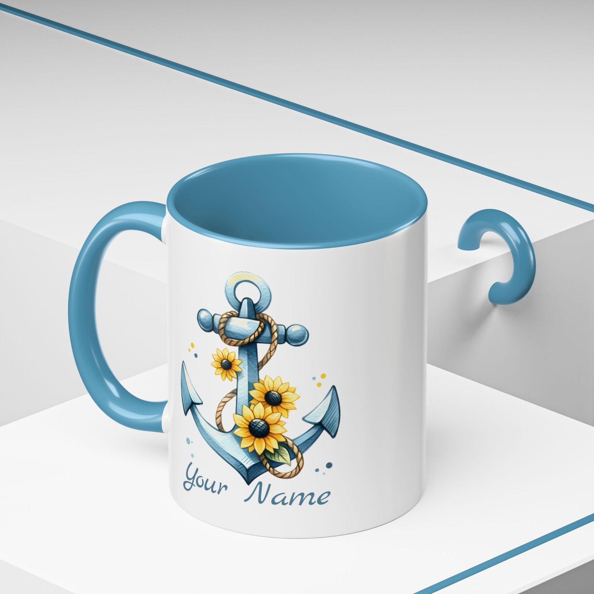 11 oz White mug with baby blue handle and interior with Anchor and Sunflowers with text Seas the Day