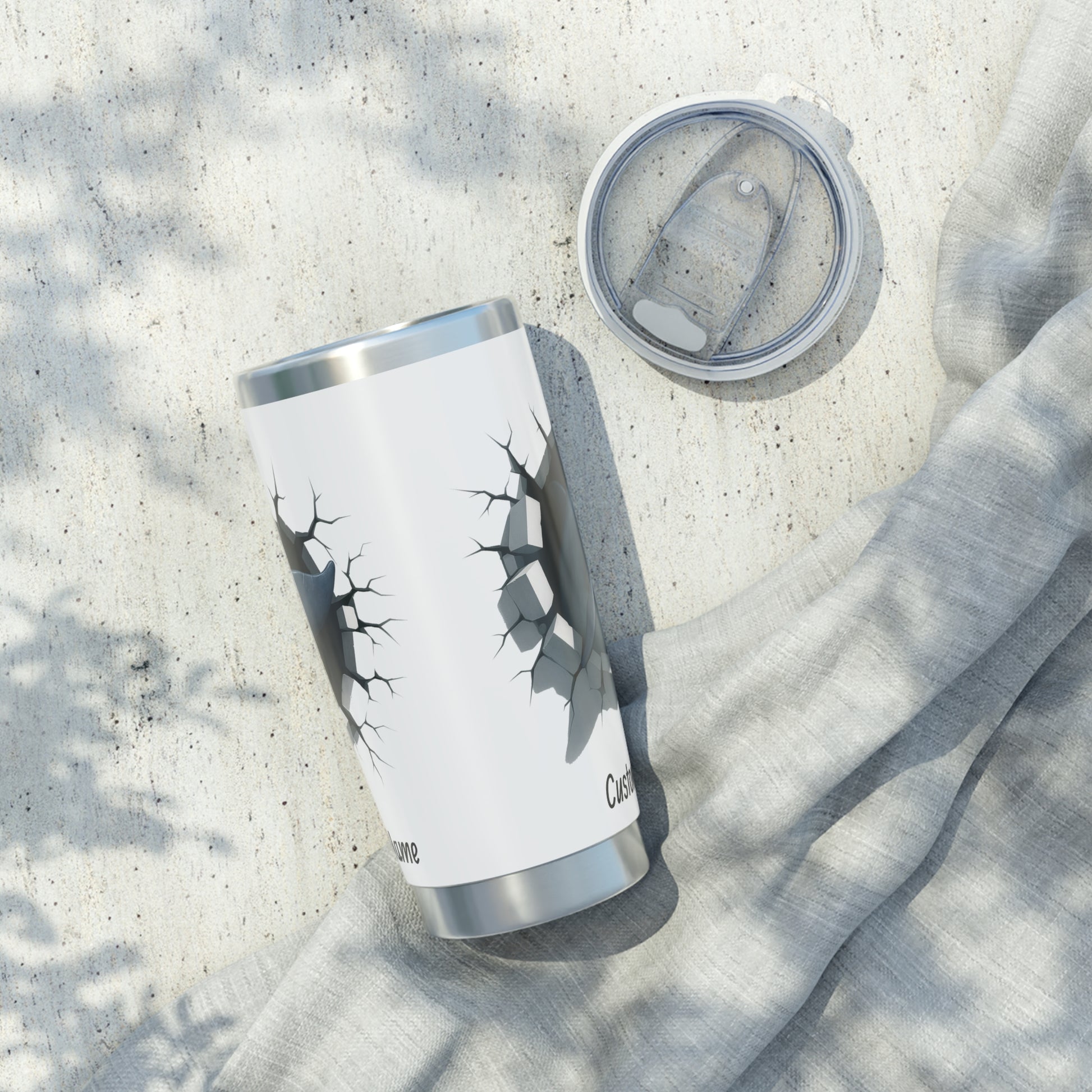 Side view of a white tumbler with dolphin design breaking out personalized.