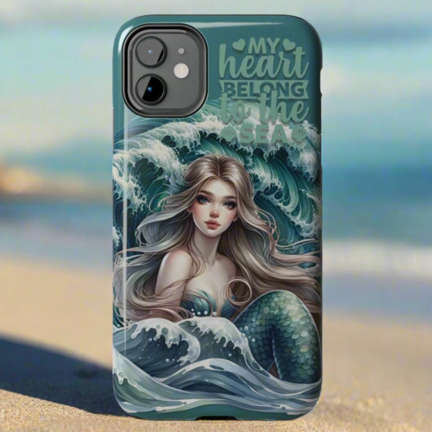 Phone Case with Flowy mermaid with ocean wave behind and text My Heart Belongs to the Sea