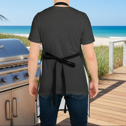 Person wearing a black apron in a kitchen setting