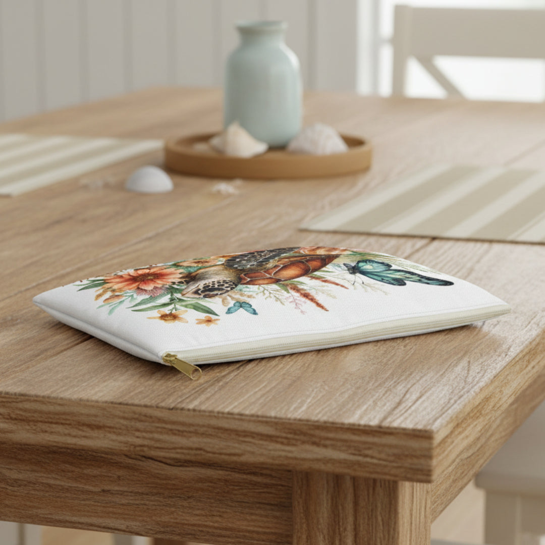 Pouch with a turtle and floral design on a white background