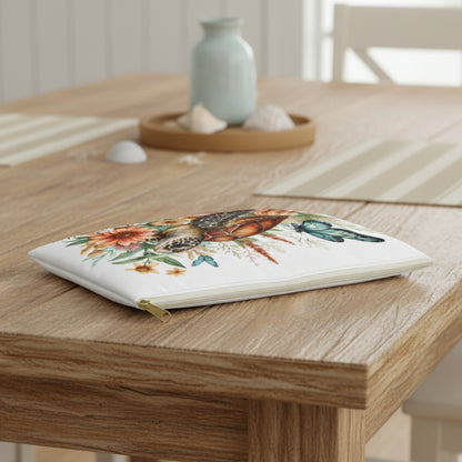 Pouch with a turtle and floral design on a white background