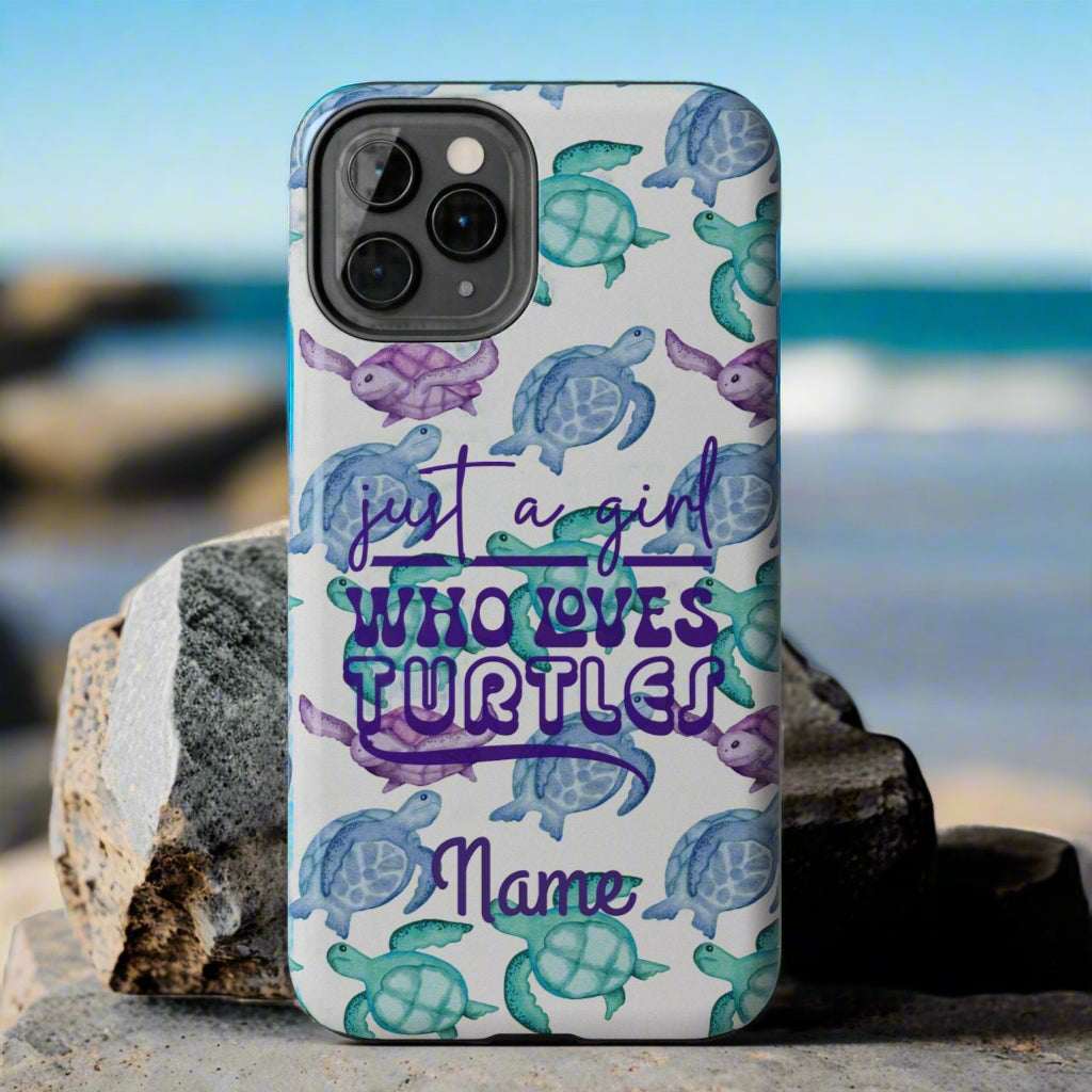Phone case with sea turtle design and text 'just a girl who loves turtles' on a gray background