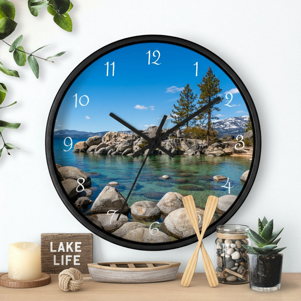 Wall clock with scenic design of a lake and mountains on a white wall.
