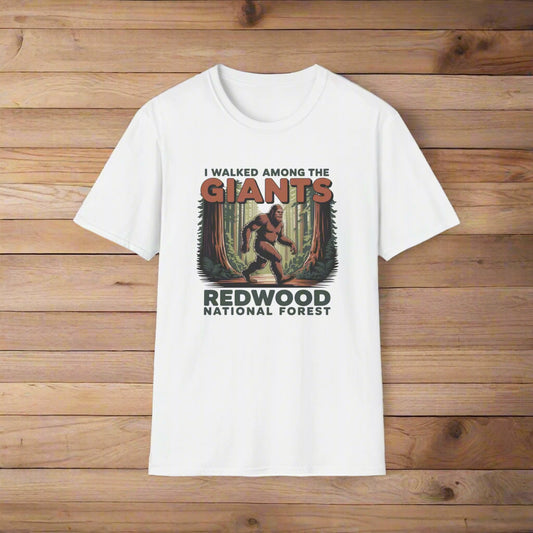 White t-shirt with a graphic of a bigfoot and text about Redwood National Forest on a white background