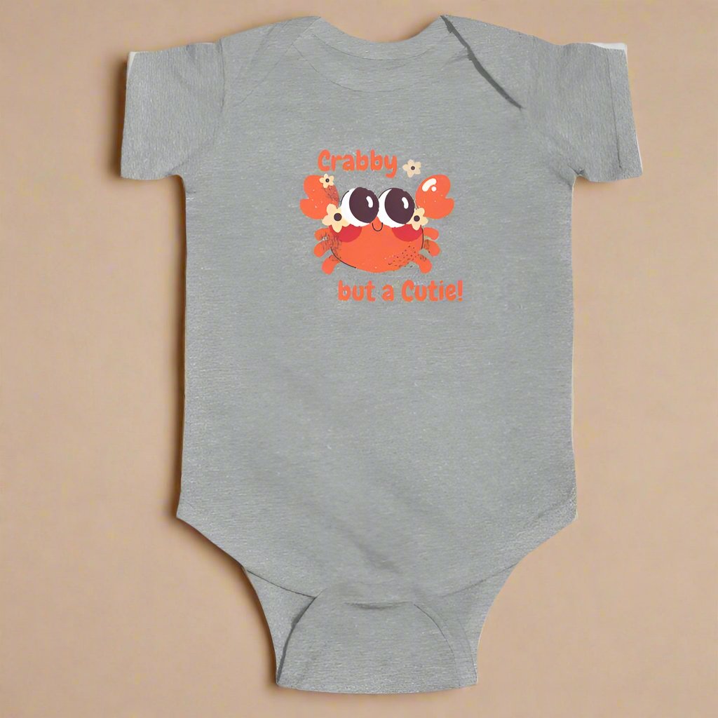 Gray short sleeved body suit with cartoon crab that says crabby but a cutie