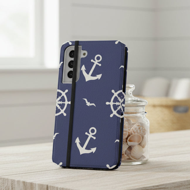 Flip Phone case with nautical design featuring anchors and ship wheels on a blue background