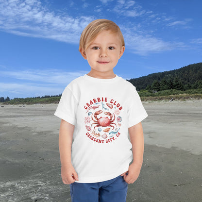 White Toddler t-shirt with the phrase “Crabbie Club Crescent City, CA” and a playful cartoon crab graphic.