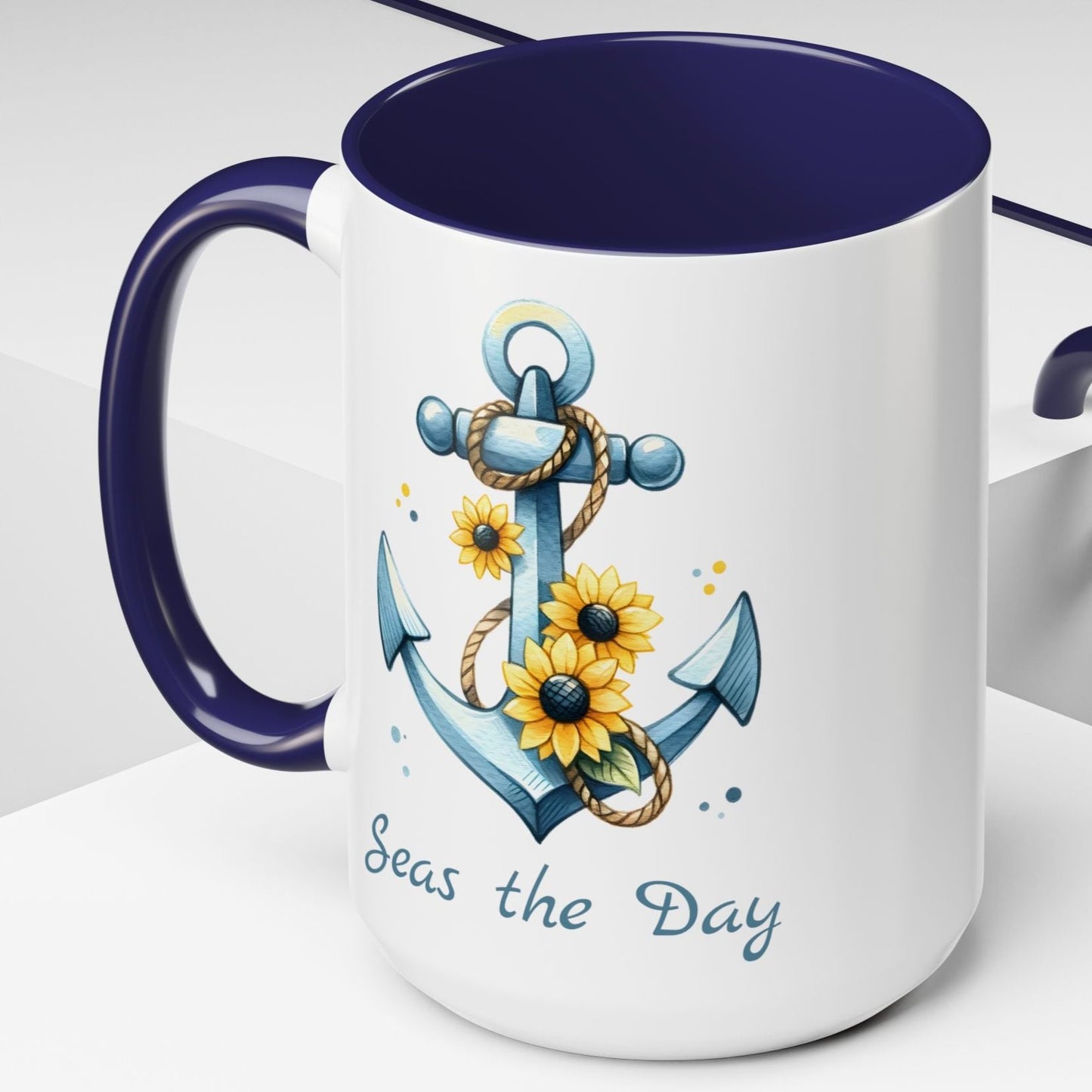 15 oz  White mug with blue handle and interior with Anchor and Sunflowers with text Seas the Day