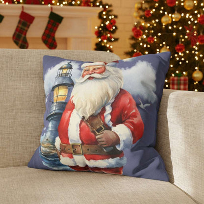 Decorative pillow with Santa Claus and lighthouse design on a couch.