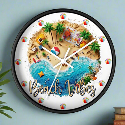 A round wall clock with a black frame and white hands with a beach scene that says Beach Vibes and has beach balls in place of the numbers to show the time.