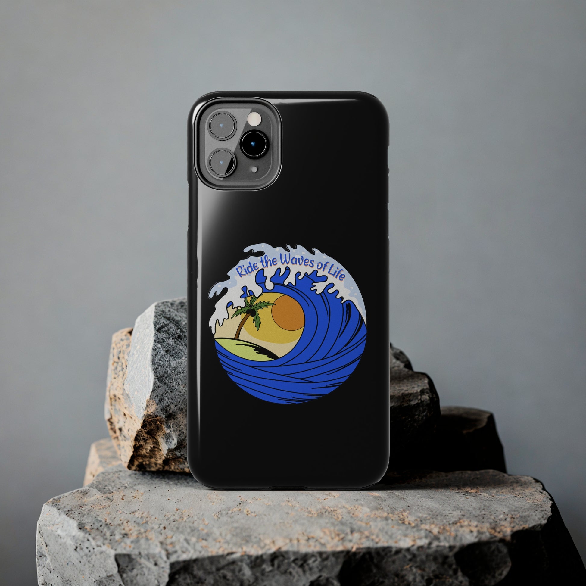 black Iphone Tough Case with a blue wave and sunset that says Ride the Waves of Life