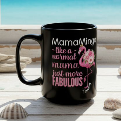 Black mug with pink and white text and flamingo design on a white background