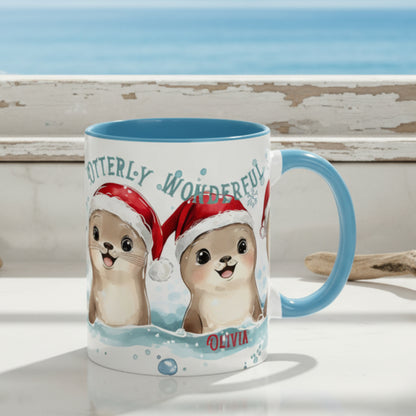 Mug with otters wearing Santa hats and the text 'Otterly Wonderful Olivia' on a white background.