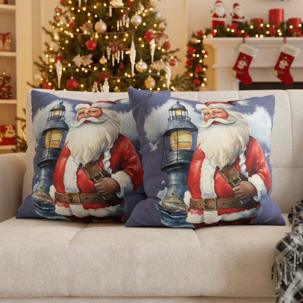 Two decorative pillows with Santa Claus with a lighthouse on a sofa.
