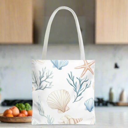 16" x 16" White tote bag with pastel blue and coral seashells, starfish, and underwater plants, with white handles.