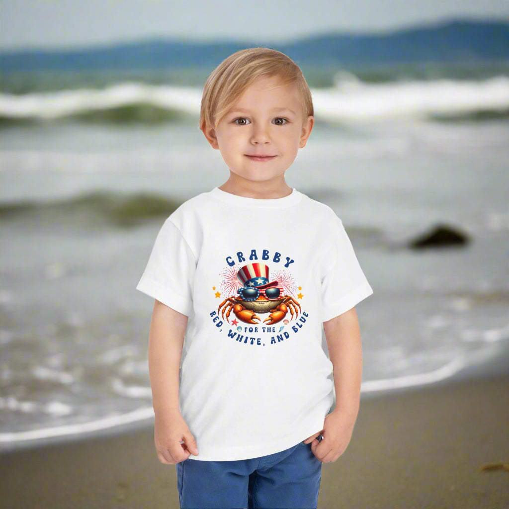 Child wearing a white t-shirt with a colorful graphic and text on a white background