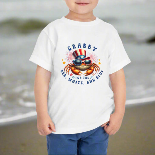 Child wearing a white t-shirt with a colorful graphic and text on a white background