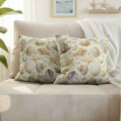 Decorative pillows with shell pattern on a gray sofa