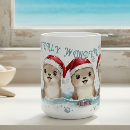 Mug with cartoon otters wearing Santa hats and the text 'Otterly Wonderful Olivia' on a white background.