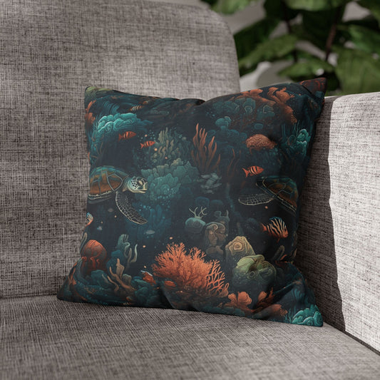 14" x 14" Decorative pillow with underwater scene with sea turtles on a gray couch.