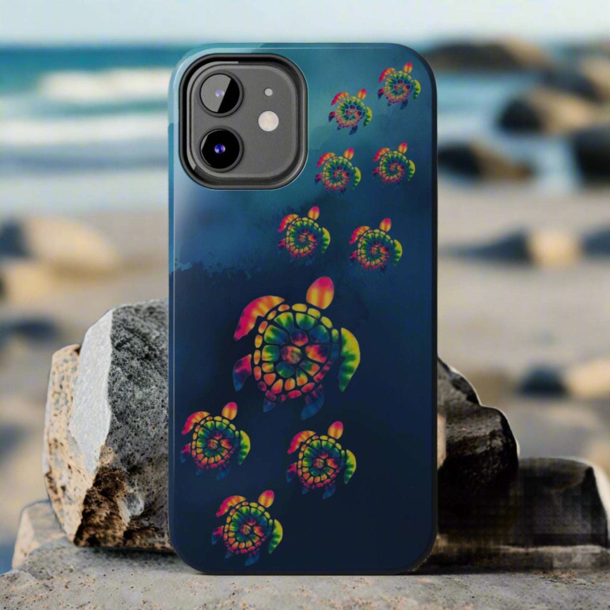 Phone case with colorful turtle design on a blue background